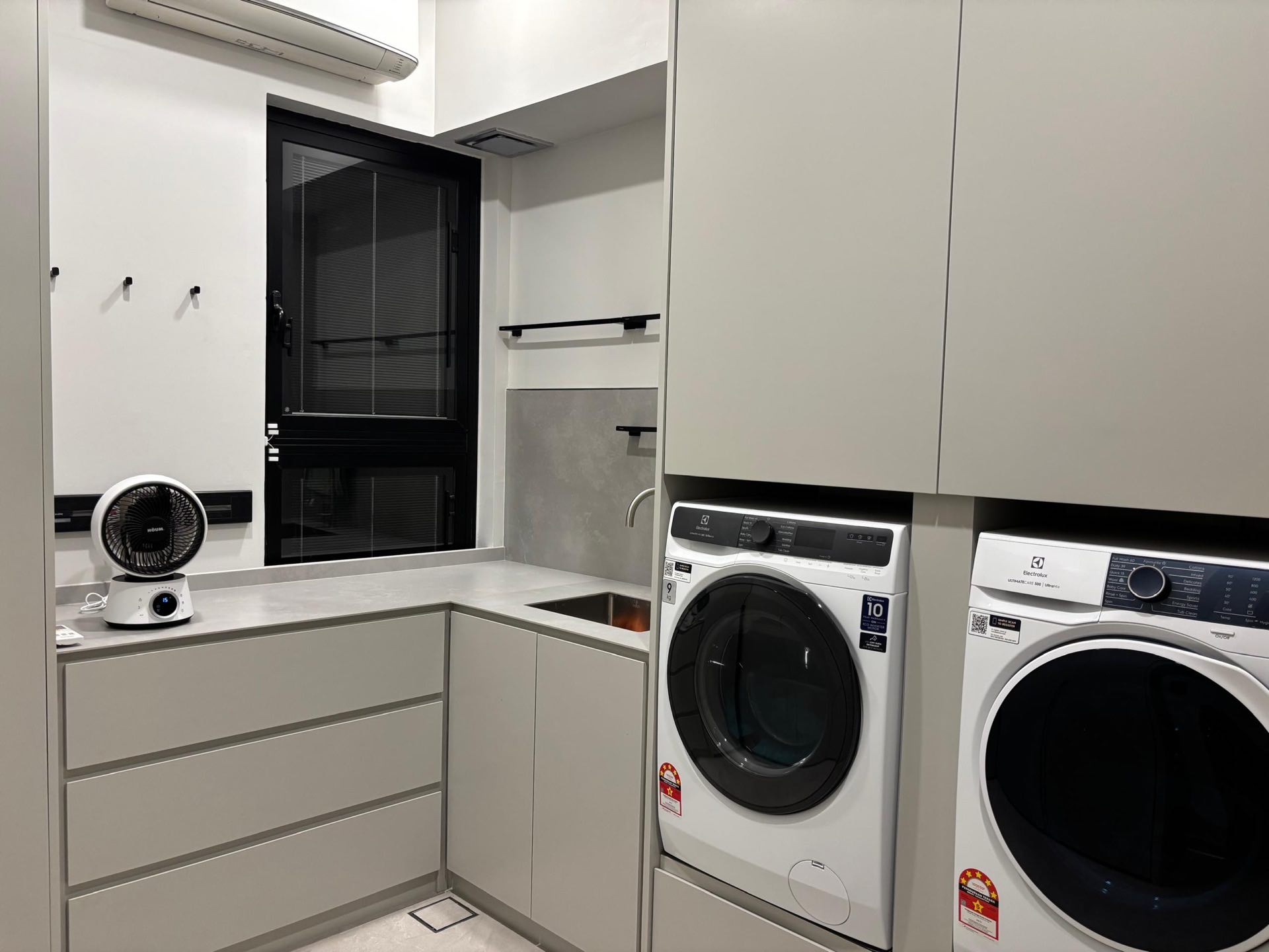 Functional laundry area with custom cabinetry